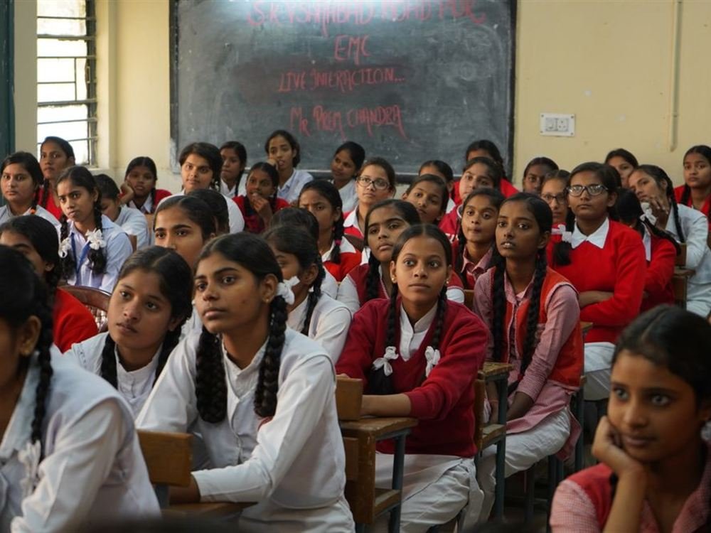 Schoolgirls listening in a classroom